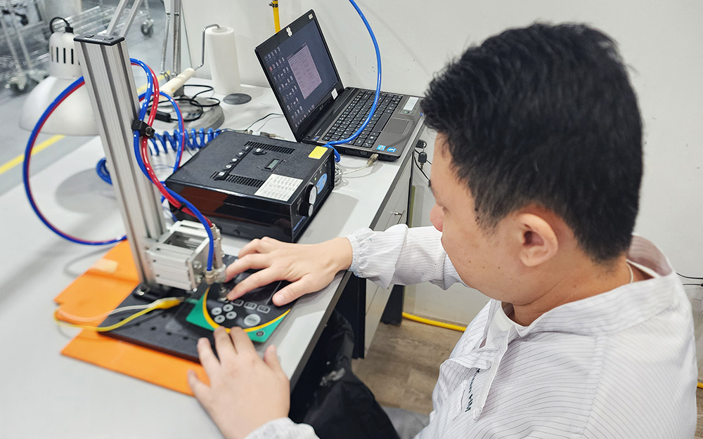 Engineer Testing Tactile Feel Of Domes